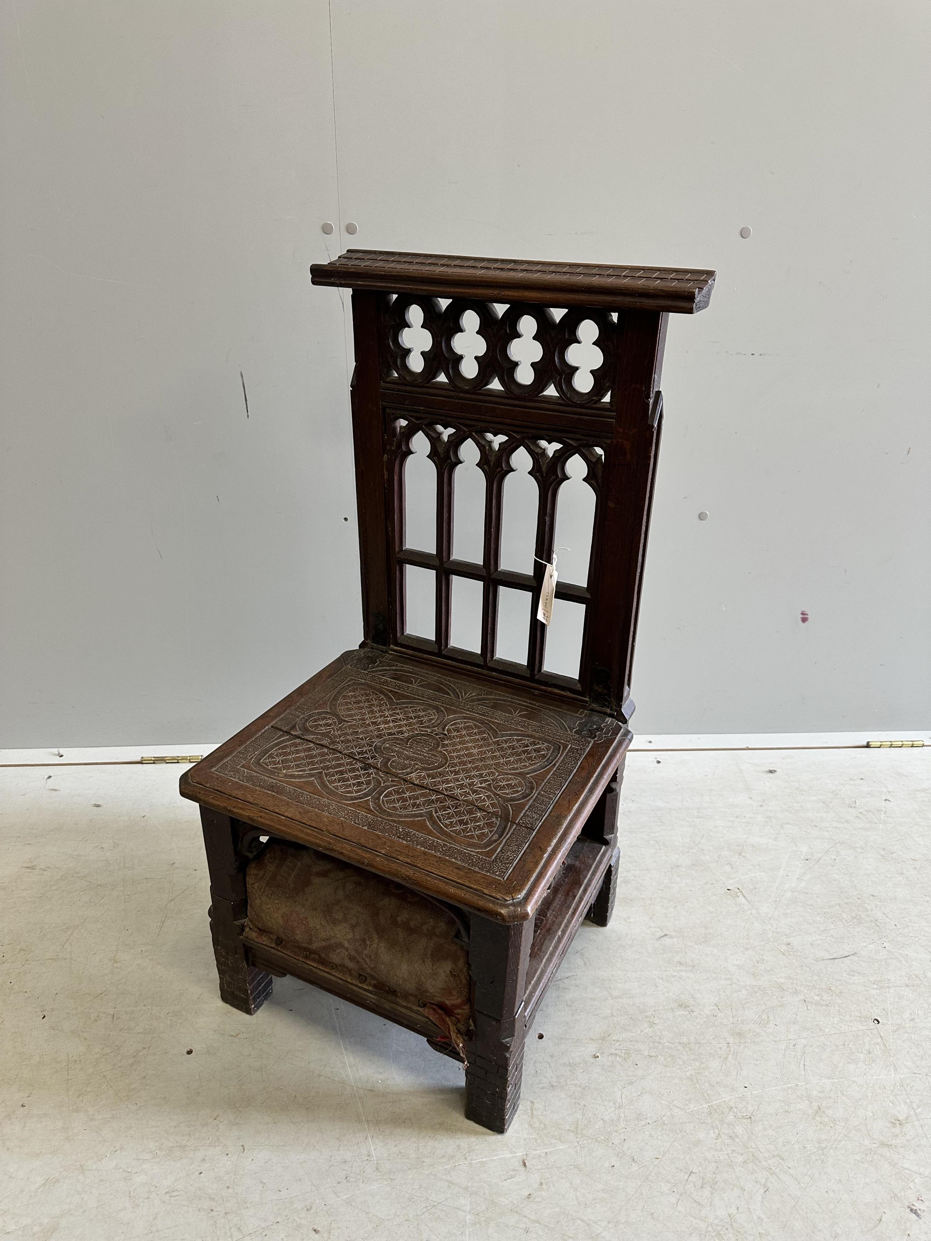 A 19th century French Gothic Revival carved oak prie dieu, width 44cm, depth 40cm, height 89cm. Condition - fair